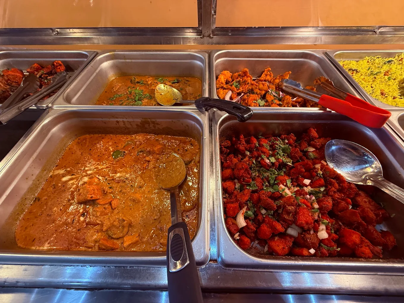Curry NaanStop weekend lunch buffet counter — curry, chicken 65, chicken biryani, lemon rice